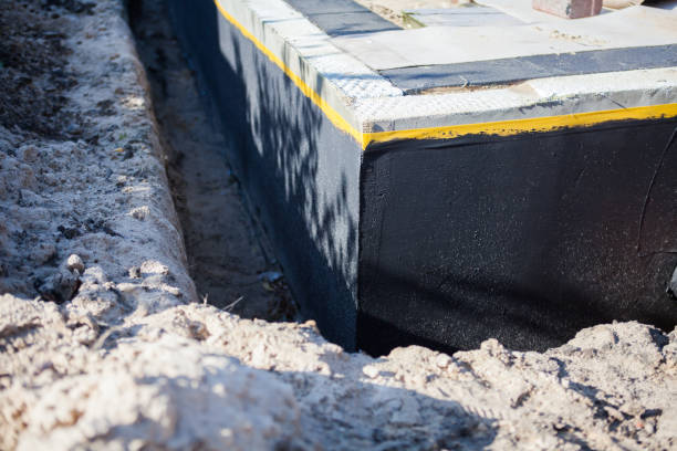 Professional Interior Drainage System technician working in Aurora, IN
